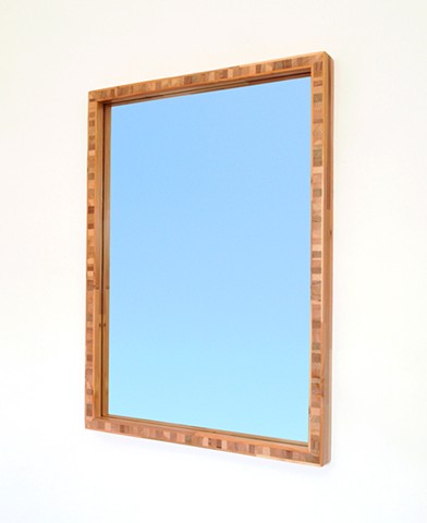 Modern wood mirror with a end grain wood core made for scarp and salvaged wood. Custom mirrors.