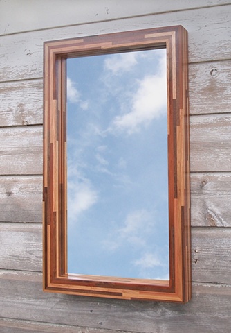 Modern wood mirror frame handmade with scrap and salvaged woods. Modern haning mirror by Andrew Traub