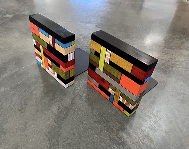 Modern wooden bookends made from salvaged wood and mixed media color. Handmade by Andrew Traub.