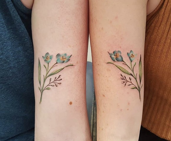 Soft floral sister tattoos by Sandra Burbul