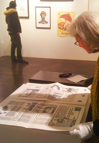Mari reading The Chronicle Times at Kala Artists' Annual, 2013
