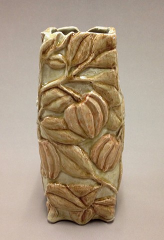 hand carved stoneware vase with clear glaze and under glaze colorants