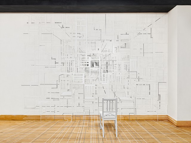 A site-specific installation presented at San Francisco State University Gallery created by Sheila Ghidini.  A graphite wall drawing depicts parts of the interior site and a found chair is drawn into the composition as well as placed in front of the draw