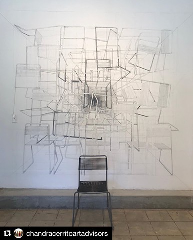 A site specific installation utilizing a found chair at the site and graphite wall drawing.  Inspired by short story by Borges about a point that contains all other points in space, The Aleph.