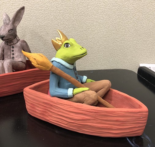 A good day for painting these clay boat figures.