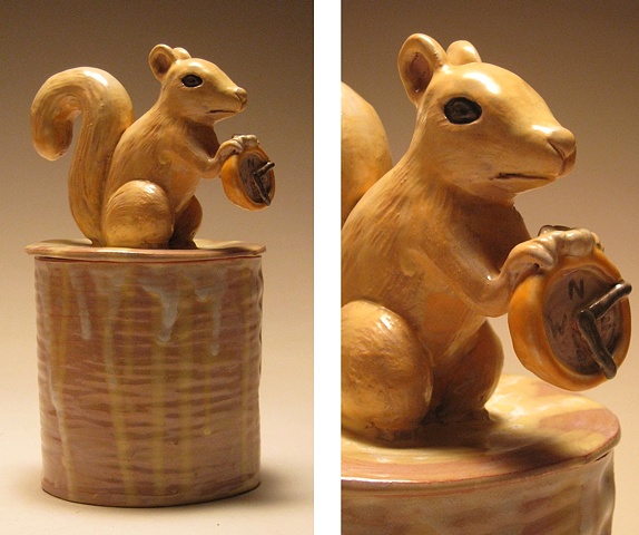 Squirrel Vessel holding compass.

(Lidded vessel form)