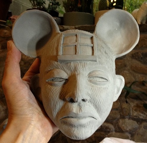 Clay mask being dried out before kiln firing.