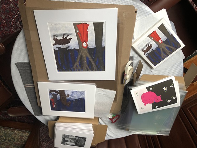 Signing and assembling Giclee prints for retail and online sale.