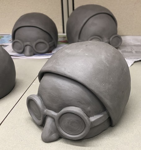 In progress work on clay swimmer heads.