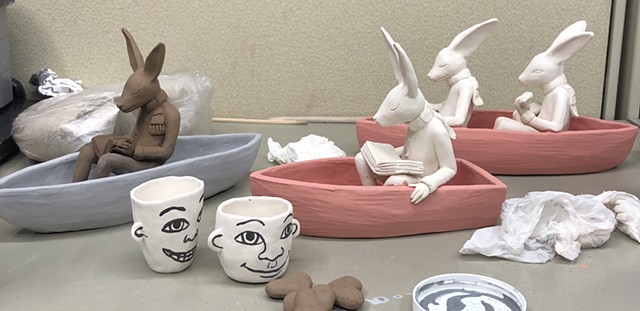 Rabbits in boats being glazed.