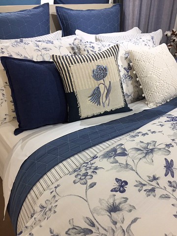 Printed toile, woven stripe and matelasse bedding