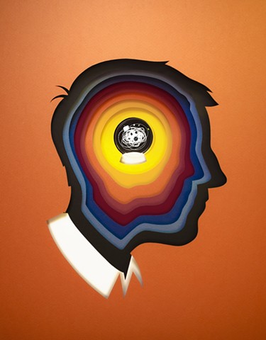 Within the silhouette of a man's head, concentric cutout shapes transition into the mind's eye- a crystal ball