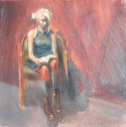 Seated Female Reading in Boots
