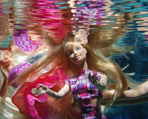 Photograph of Barbie Doll and her reflection by Daena Title
