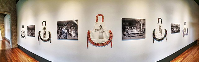 Installation view of the 5 festive aprons