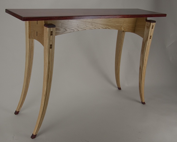 Paduak top table with laminated ash legs