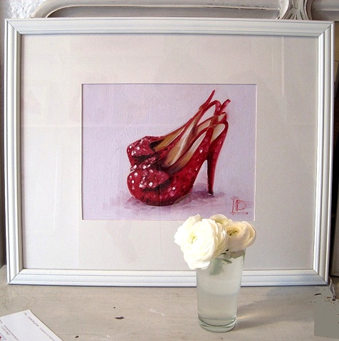 original oil painting of red sparkly shoes by Brighton artist Linda Boucher. Photographed in her brighton seafront studio.