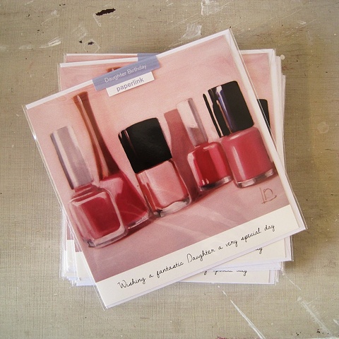 Bottles of pale pink nail polish adorn the front of this greetings card, commissioned and licensed by Paperlink.
