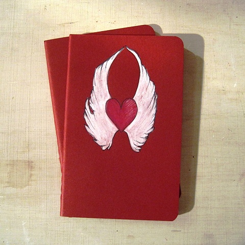 original artwork on a Moleskine Notebook, a classic tattoo design featuring a winged love heart by Linda Boucher. 