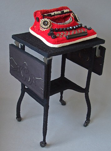 Mixed media sculpture by Marie Bergstedt of typewriter and stand
