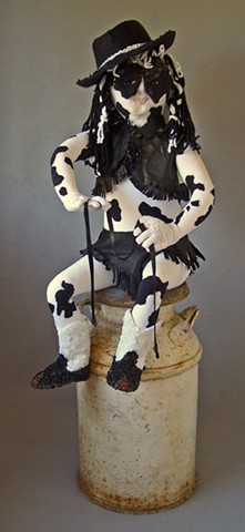 Mixed media sculpture of cow-like girl sitting on milk can by Marie Bergstedt