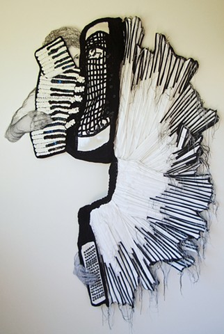 3-D mixed media wall artwork of cascading accordian by Marie Bergstedt