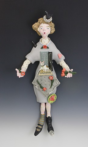 Porcelain and mixed media wall figure by Laura Peery
