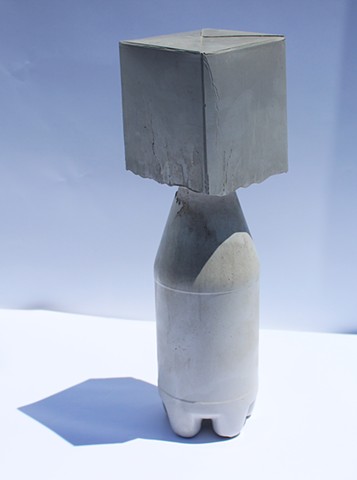 Cast concrete into found plastic bottle and milk carton 