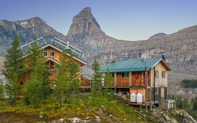 The Lodge on the Left with Showers, Sauna and Toilets on the Right and Sharkfin Peak Behind