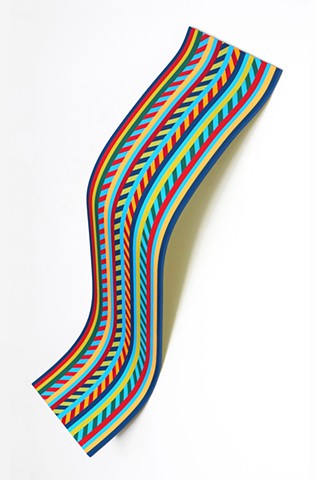 wall sculpture shaped like a playground slide painted in stripe design
