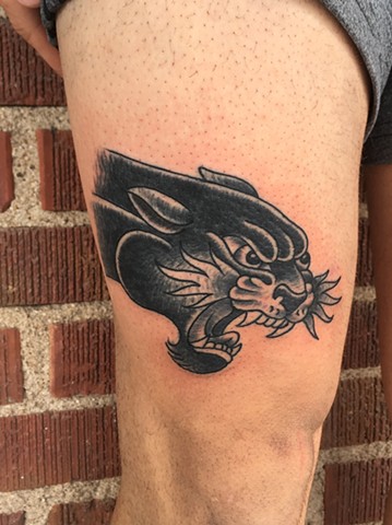 black and grey panther thigh tattoo