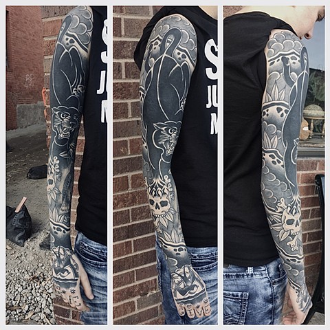 Panther sleeve Lincoln Nebraska tattoo
