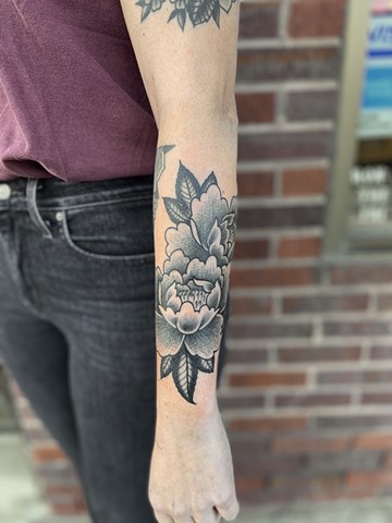 Flower pennies arm tattoo black and grey 