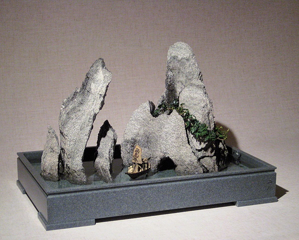 zen indoor fountain rock sculpture with ivy, fogger, and chinese figurines