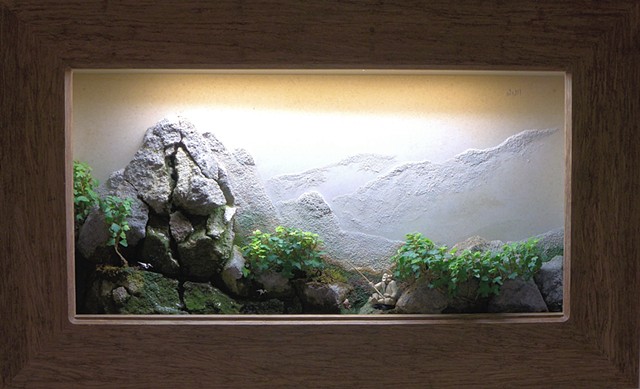 feather rock wall landscape with ivy, fountain, and miniatures