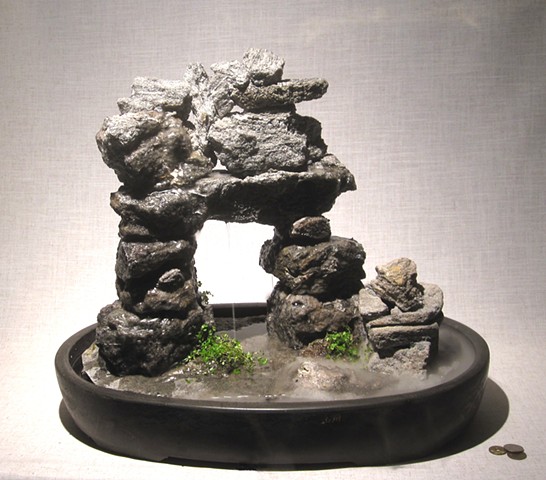 inuksuk feather rock fountain with fogger and plants