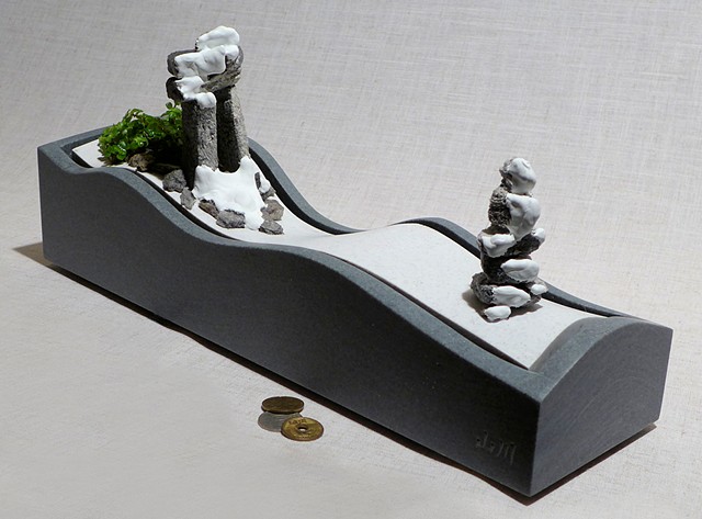 Corian tabletop fountain with inuksuit and pilea 