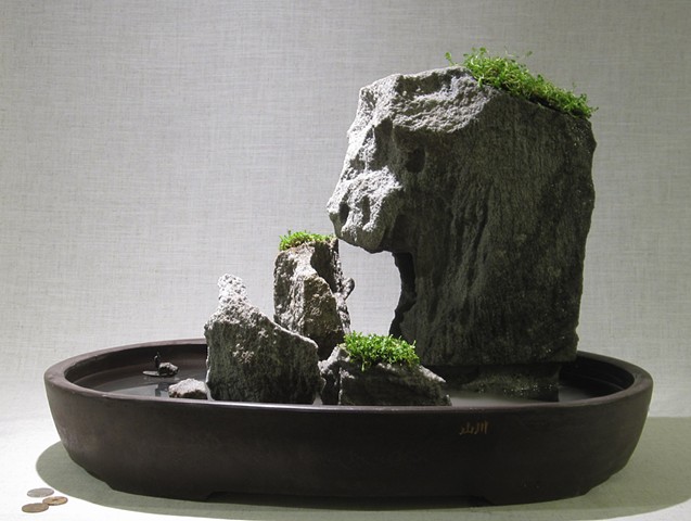 feather rock fountain with fogger, plants, and miniature boat