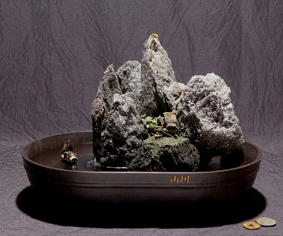 tabletop fountain with live plant and mudman miniatures