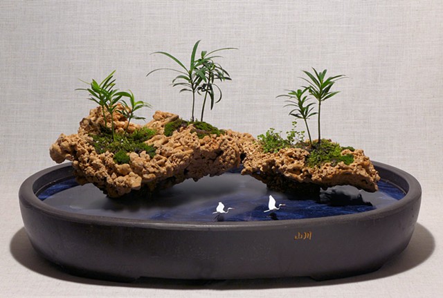 tabletop fountain with coral islands with live plants, fogger, and handmade bird figures