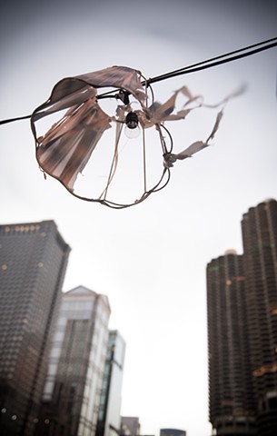 a tattered lampshade hangs above Chicago's skyline photographed by LucyMuellerPhotography