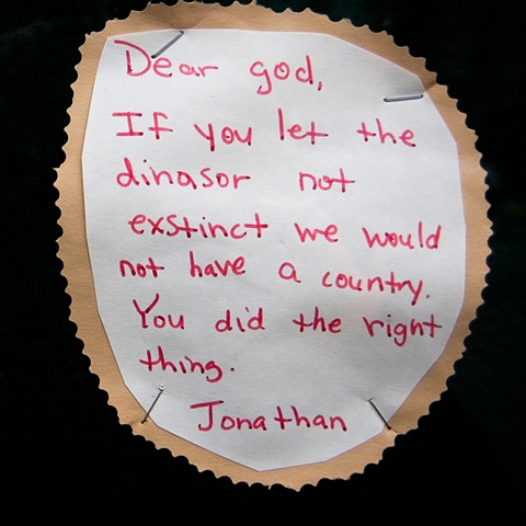 Young pupils wishes written as "dear god" letters posted at a church by lucy mueller