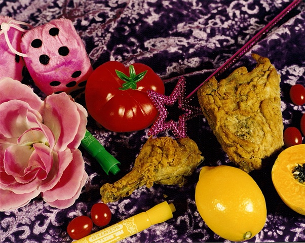 "Still Life with Pink Fuzzy Dice and Fried Chicken"