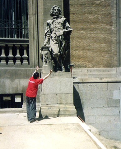 Cypher Bowing In Front of Statue of Velazquez