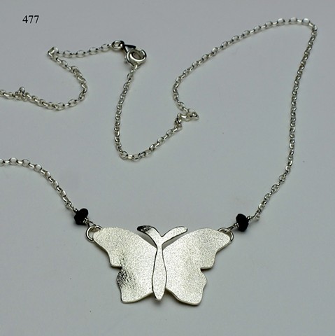 textured silver butterfly pendant on SS chain with lobster clasp, accented w/ iolite (#477)