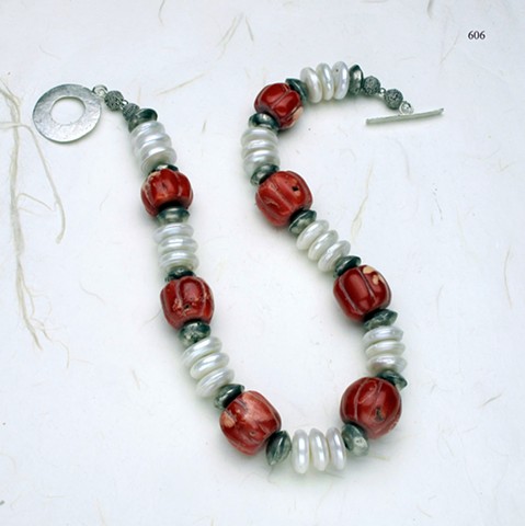 carved coral, Biwa disc pearls, Mali tribal silver beads, finished with a silver toggle (#606)