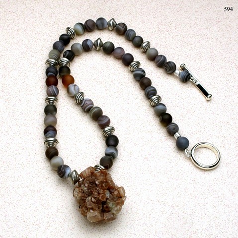 unusual argonite focal pendant accented with Botswanan agate, Hill Tribe silver beads and finished with a silver toggle (#594)