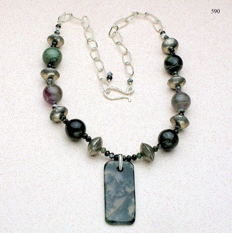 green agate pendant is paired with large round assorted agate beads, small faceted ruby zoisite and Mali tribal silver beads, the necklace is finished with a silver link chain with a forged hook clasp (adjustable in length) (#590)