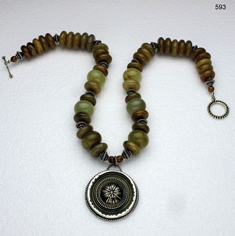 bezel set vintage celluloid & brass button with jade, silver beads & brass toggle (#358)