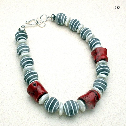 pinstriped gray flannel buffalo horn beads accented with coral & biwa disc pearls, finished with an adjustable  sterling silver hook & eye clasp (#683)
